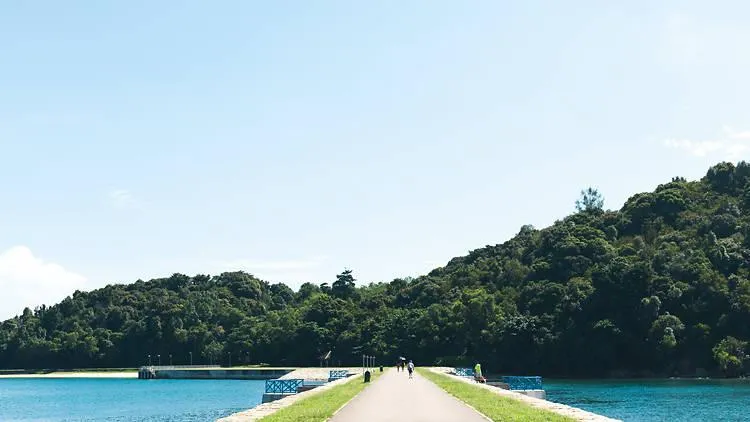St John’s Island nature trail surrounded by tropical greenery in Singapore